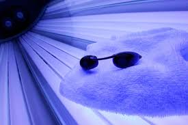 tanning goggles inside an indoor tanning bed to explain the safety requirements of using tanning goggles while indoor tanning